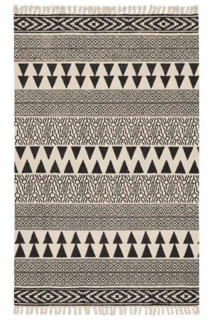 Area rugs for bedroom featuring black and ivory geometric patterns and artisan-inspired detailing Handmade Geometric Cotton Rugs with bold triangle and diamond motifs in a modern flatweave design Black and ivory geometric cotton rug designed for stylish bedroom interiors