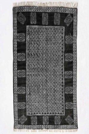 Geometric black rug with diamond pattern and decorative border Handmade Geometric Cotton Rugs inspired black and ivory area rug design Modern geometric black area rug with artisan-style woven motifs